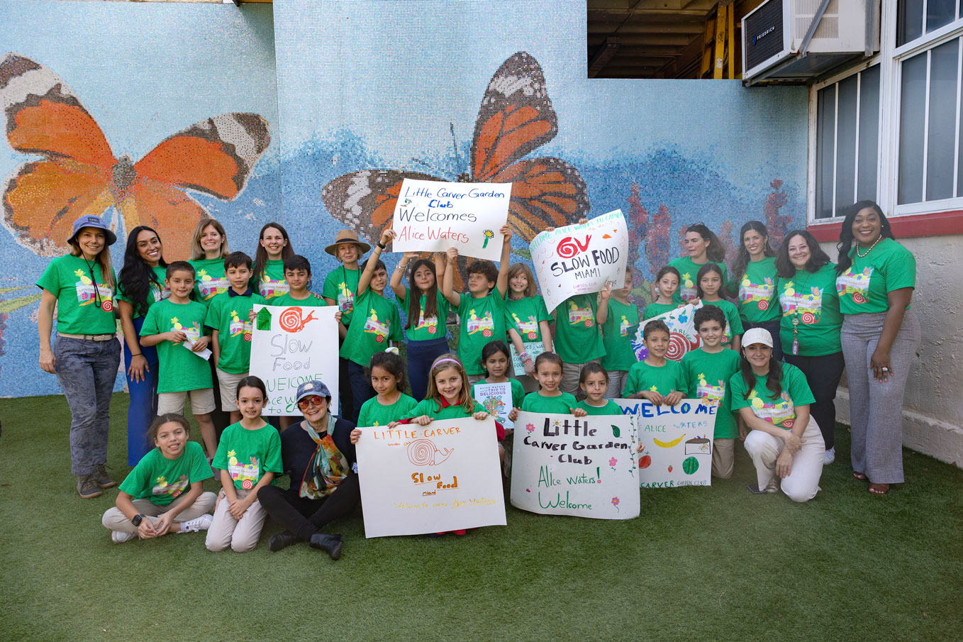 Alice Waters, seated, with students from Little Carver 