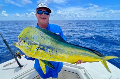 George Poveromo, host of Discovery Channel’s “George Poveromo’s World of Saltwater Fishing” displays a 28-pound mahi mahi he caught while fishing off Islamorada 