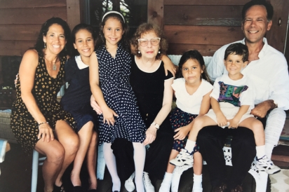 Lois Weisberg (center) surrounded by family members 