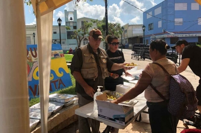 Hoyos with José Andrés serving meals in Puerto Rico 