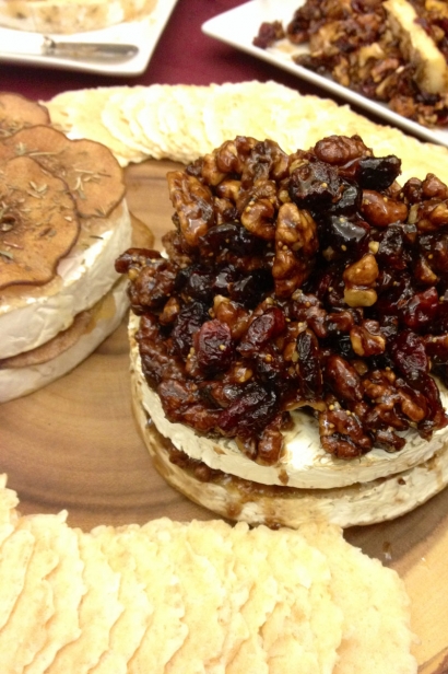 Double creme brie stuffed with fig spread and topped with caramelized walnuts