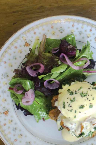 Roasted kale and tomato Benedict with thyme Hollandaise and local greens.