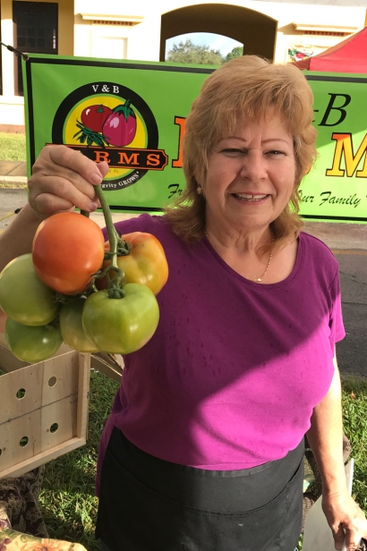 Farmer Pam Vick at farmers market in the parking lot