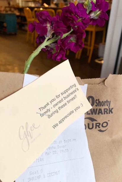Ghee takeout bags adorned with fresh flowers