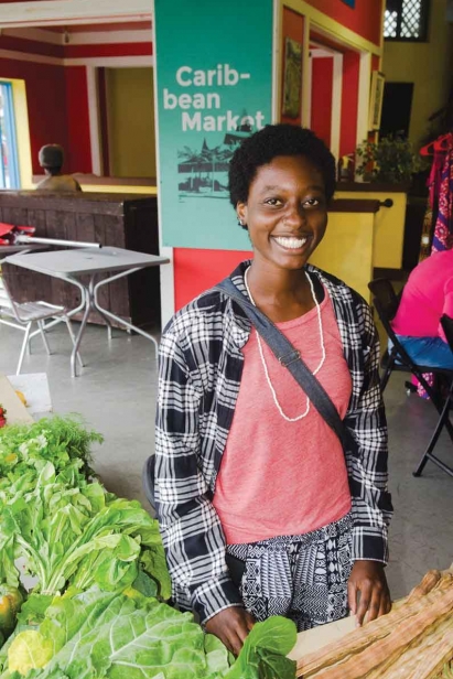 Mandoline Simeon sells fresh produce grown at Cerasee Farm in Liberty CIty