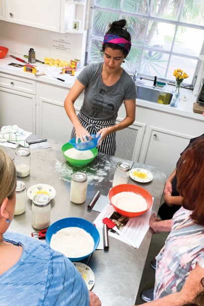 Meneses teaches a class in making scones at Montgomery Botanical Garden
