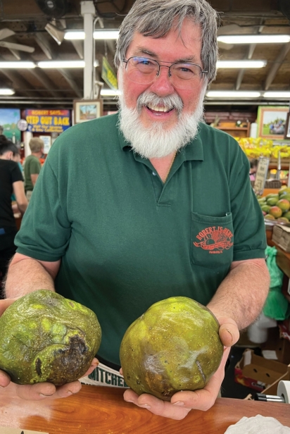 Robert shows off black sapote at Robert Is Here