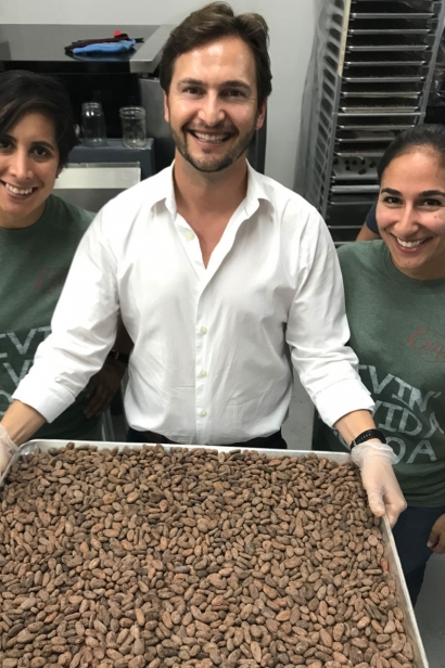 Ryan Amsel displays a tray of cacao beans