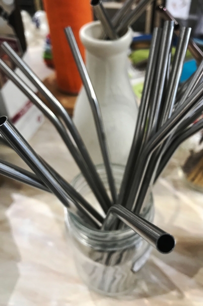 Stainless steel straws and bamboo cutlery replaces plastic ware