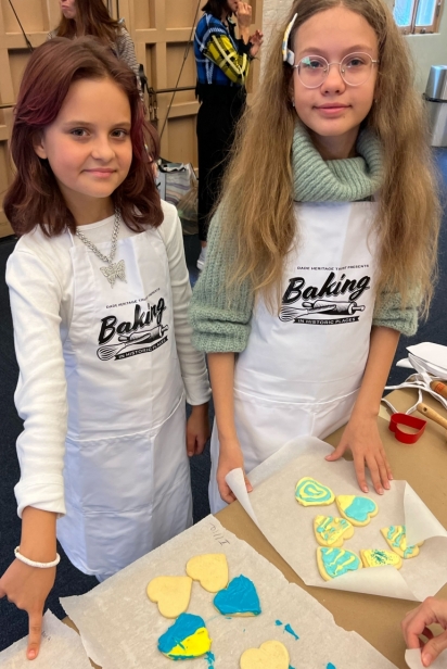 Kateryna Bratko and Maria Pryshliak show their cookies