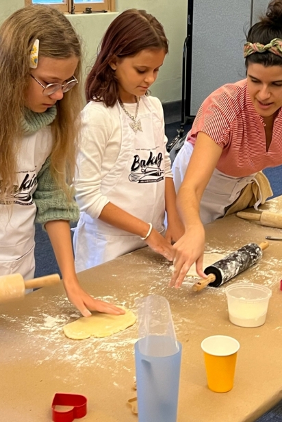 Instructor Lucia Meneses shows how to roll out the dough to the proper thickness