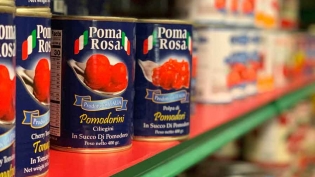 Rows of canned Italian tomatoes at Laurenzos