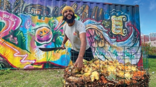 Quinn Metoyer with compost at Green Haven Project, Overtown