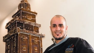 Chef Vincent Catala in front of the gingerbread Freedom Tower