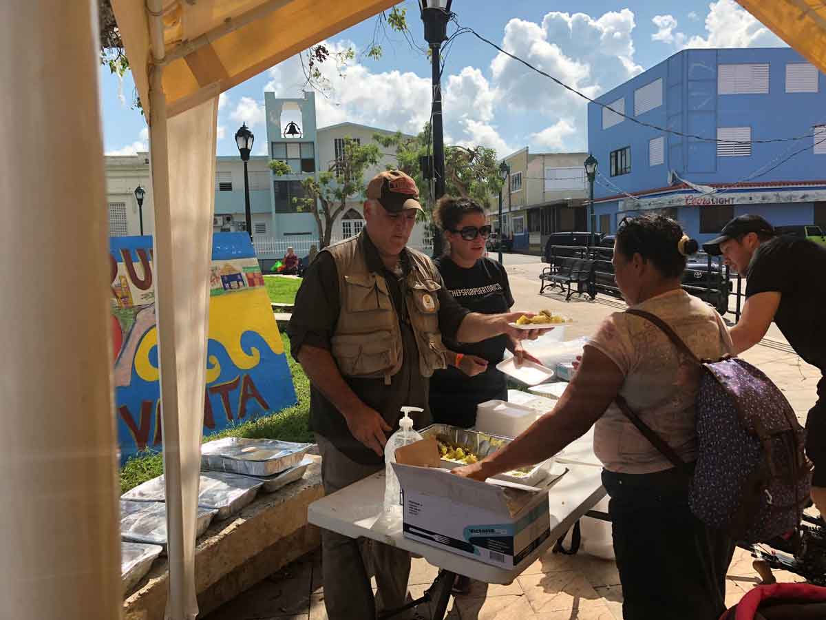 Hoyos with José Andrés serving meals in Puerto Rico 