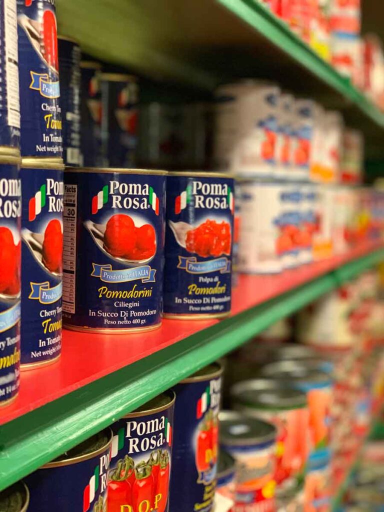 Rows of canned Italian tomatoes at Laurenzos