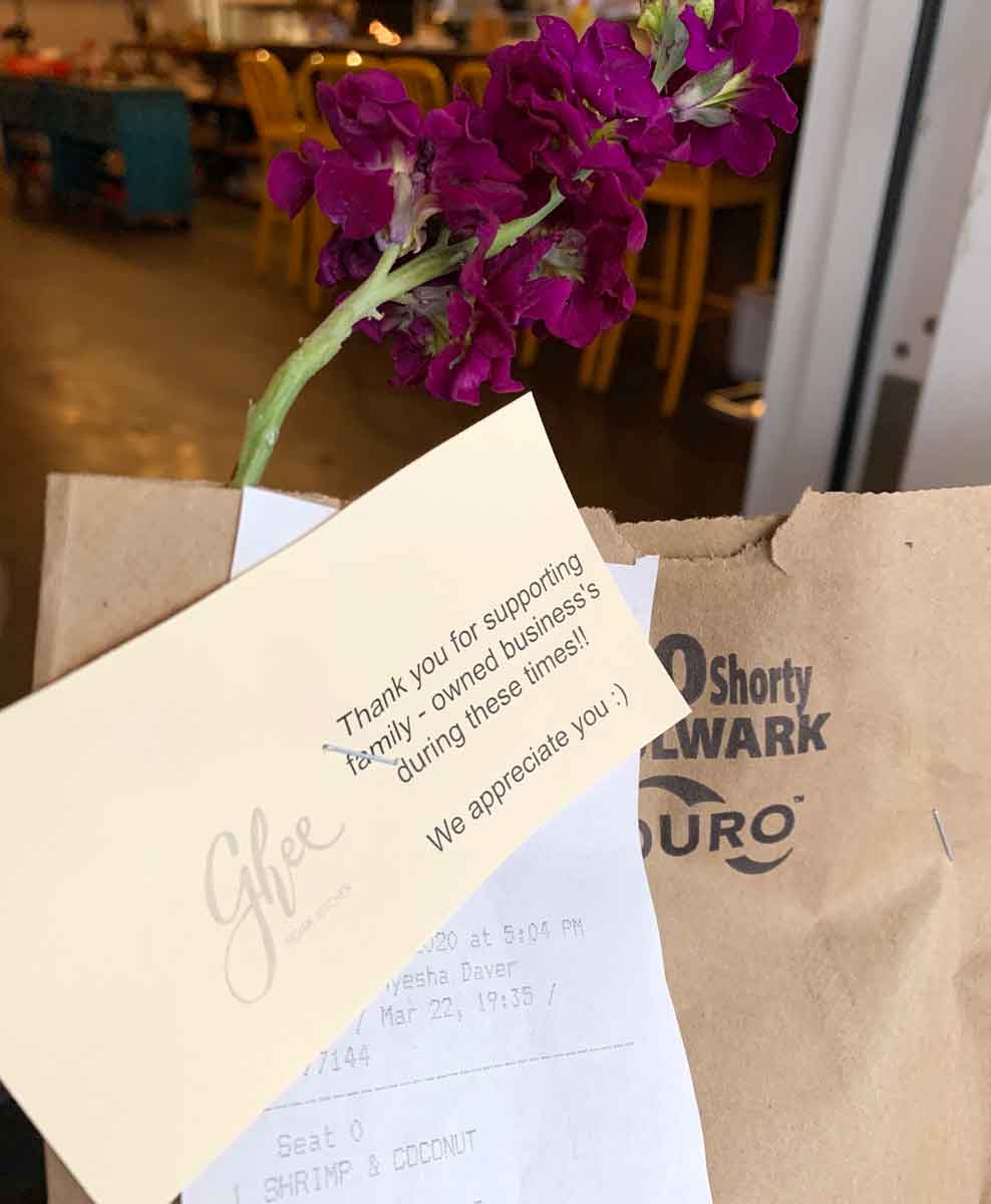 Ghee takeout bags adorned with fresh flowers
