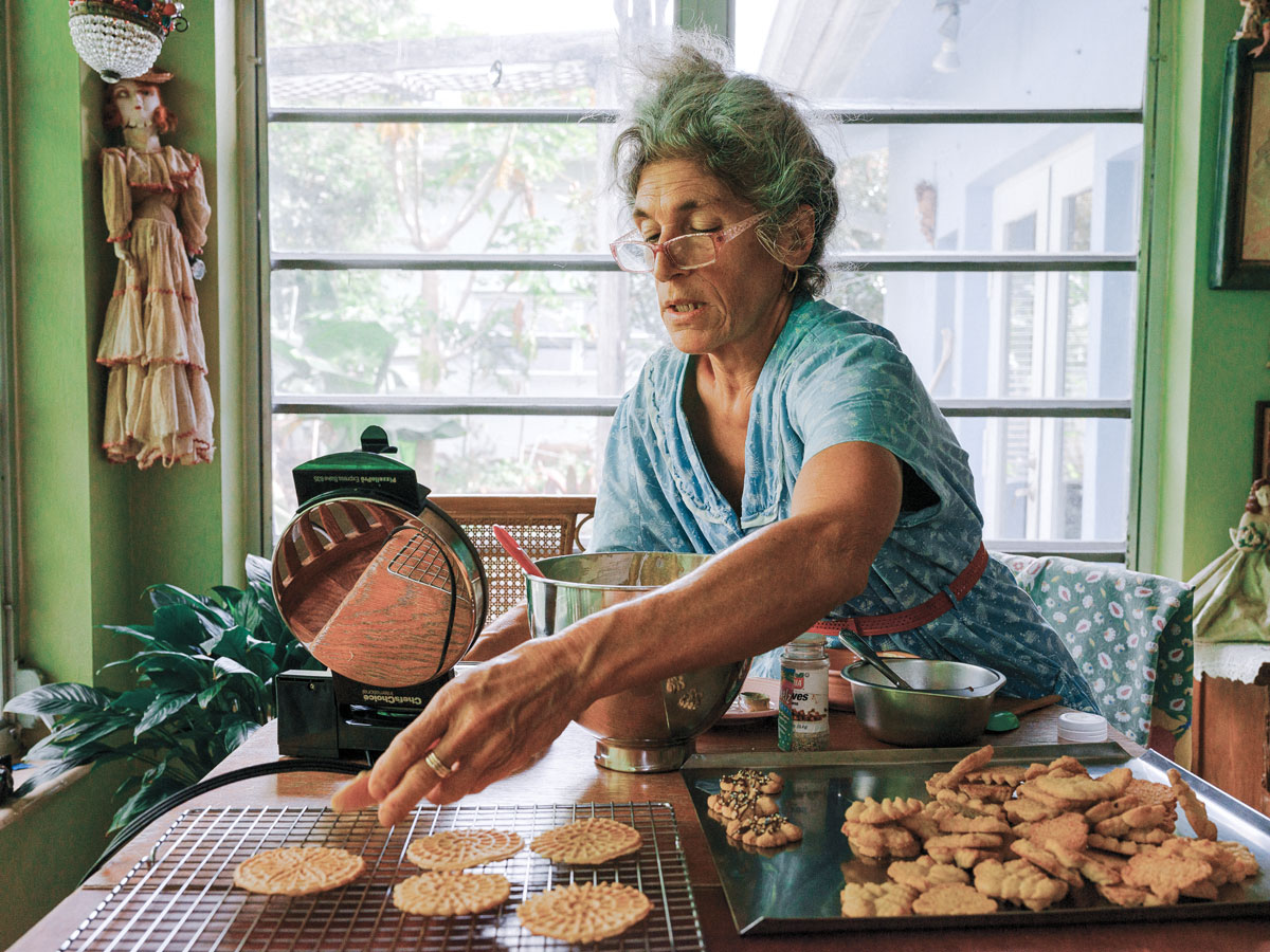 Concetta Pilato sets her pizzelle on a rack to cool