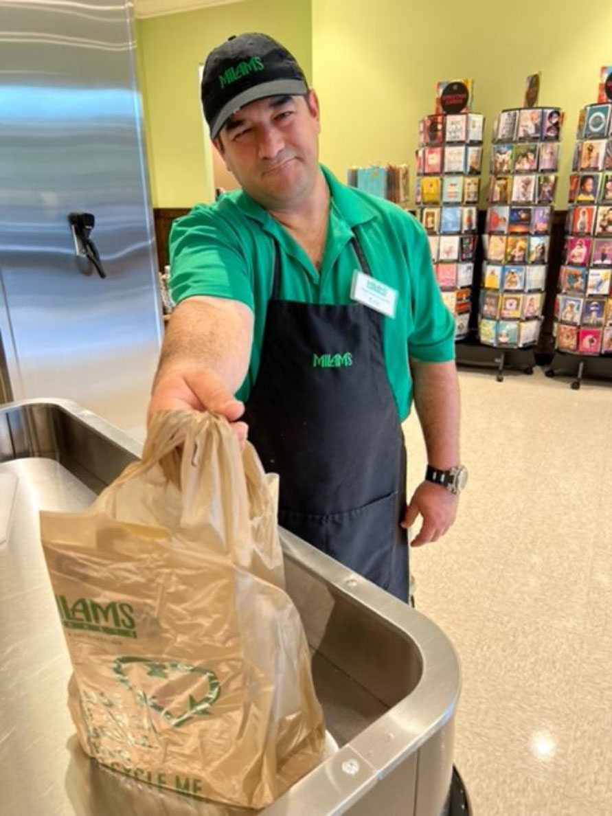 Friendly employees greet customers