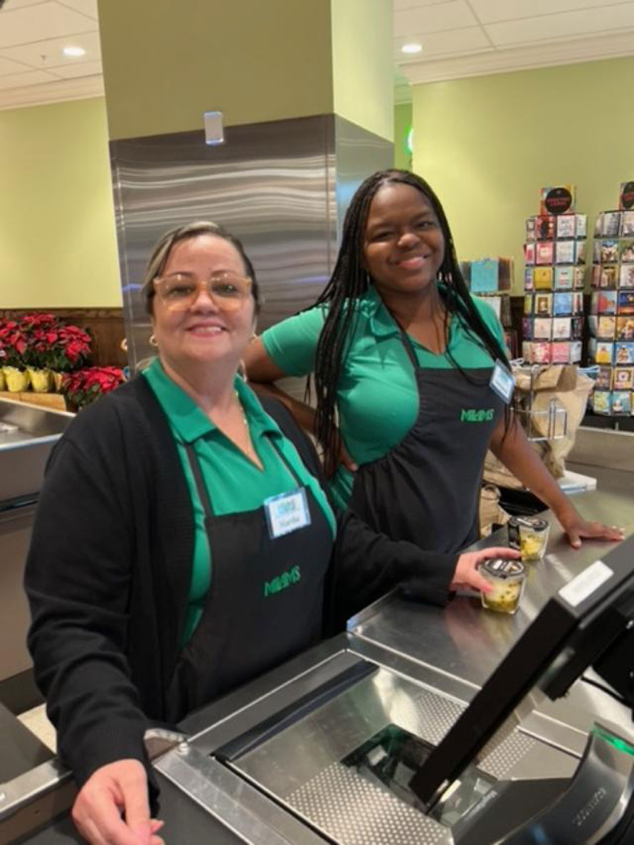 Cashiers ready to check customers ou